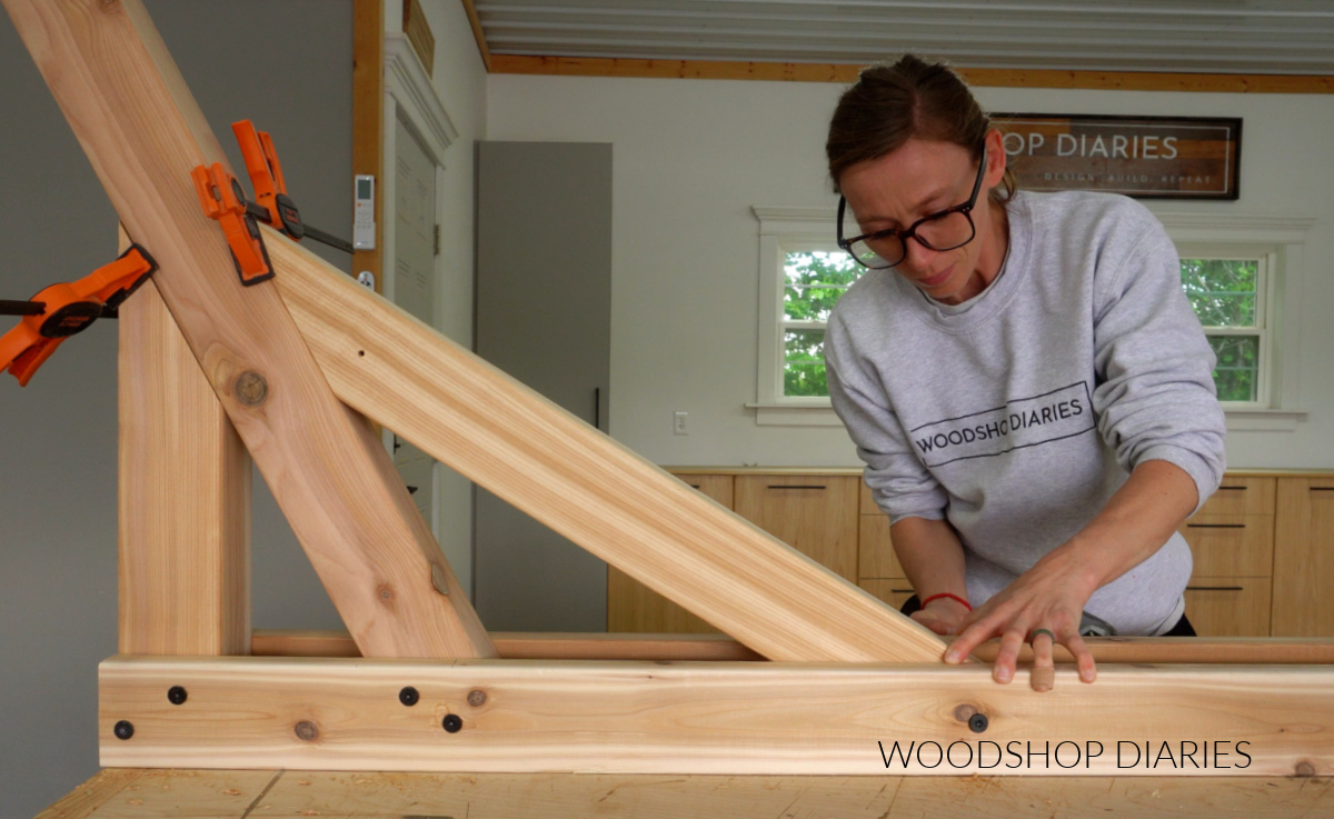 Shara Woodshop Diaries screwing long support of hammock stand to bottom runner