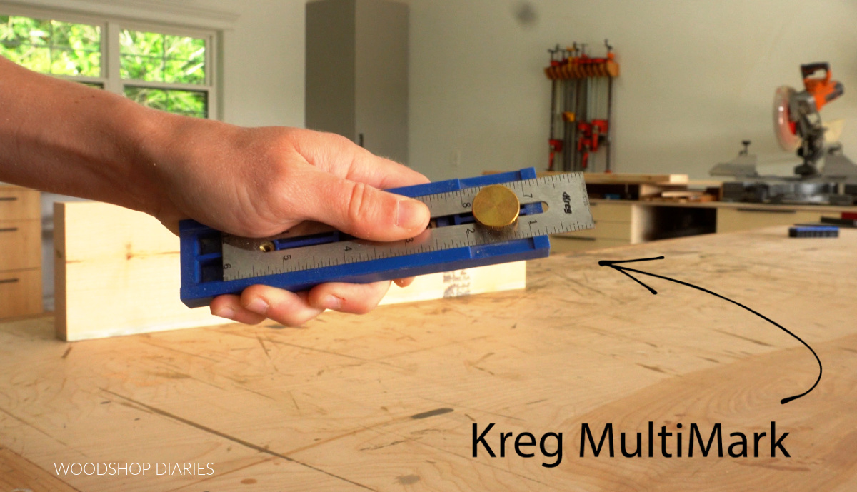 Shara Woodshop Diaries holding up Kreg MultiMark tool showing set to ¾"