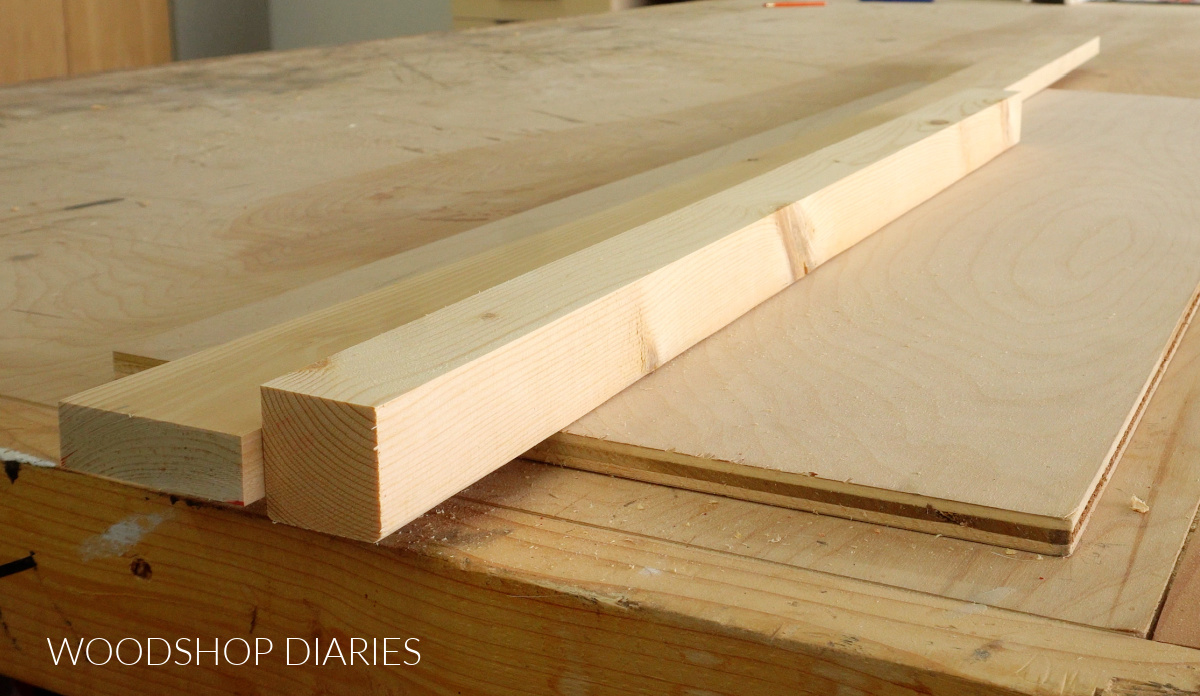 Scrap wood materials to build floating shelf laid out on workbench