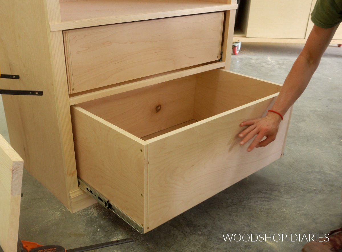 Drawer boxes installed into armoire cabinet