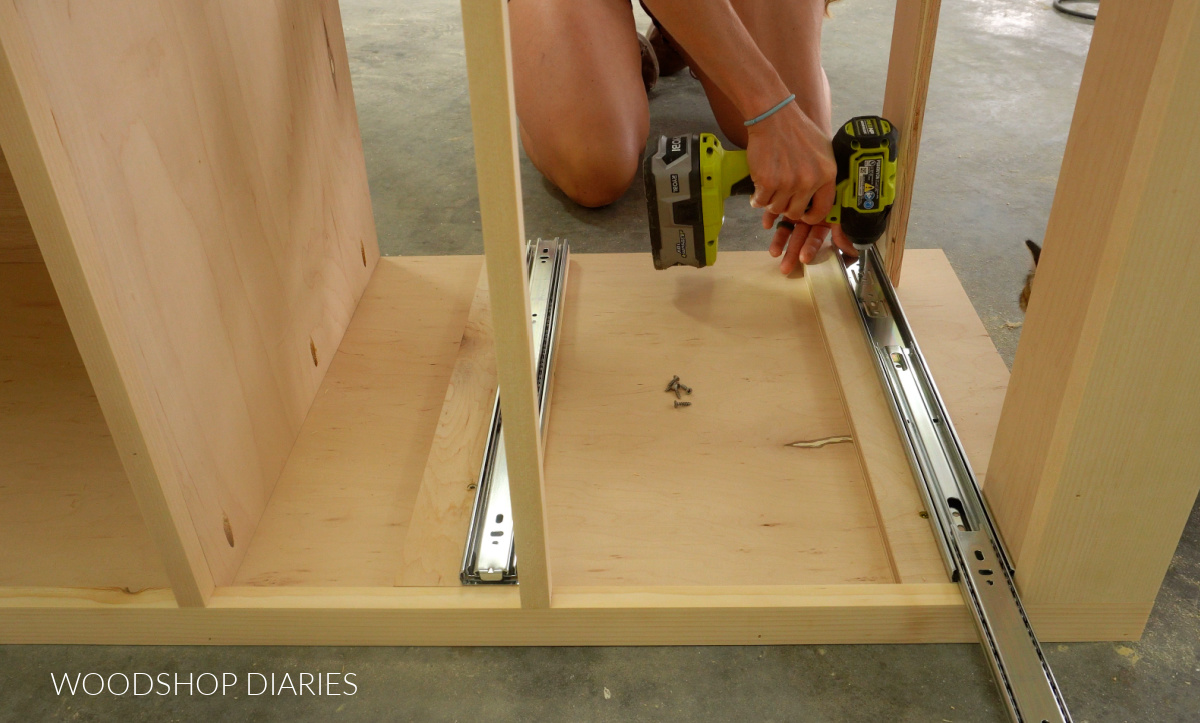 Shara Woodshop Diaries installing drawer slides into tall cabinet box onto spacer blocks