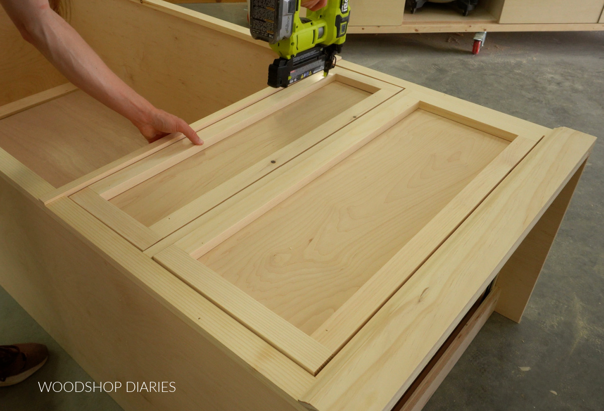 Shara Woodshop Diaries nailing drawer front frame onto front of drawer boxes on cabinet