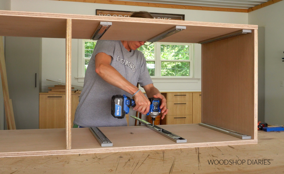 Shara Woodshop Diaries installing drawer slides into bottom section of built in cabinet