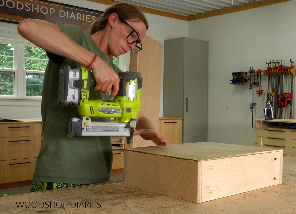 Shara Woodshop Diaries nailing plywood bottom panel onto drawer boxes for closet built in