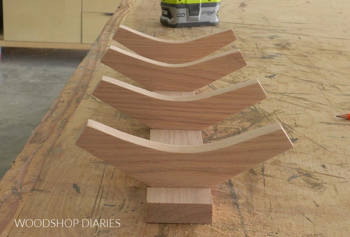 Dry fitting DIY towel rack hooks onto back board to determine spacing