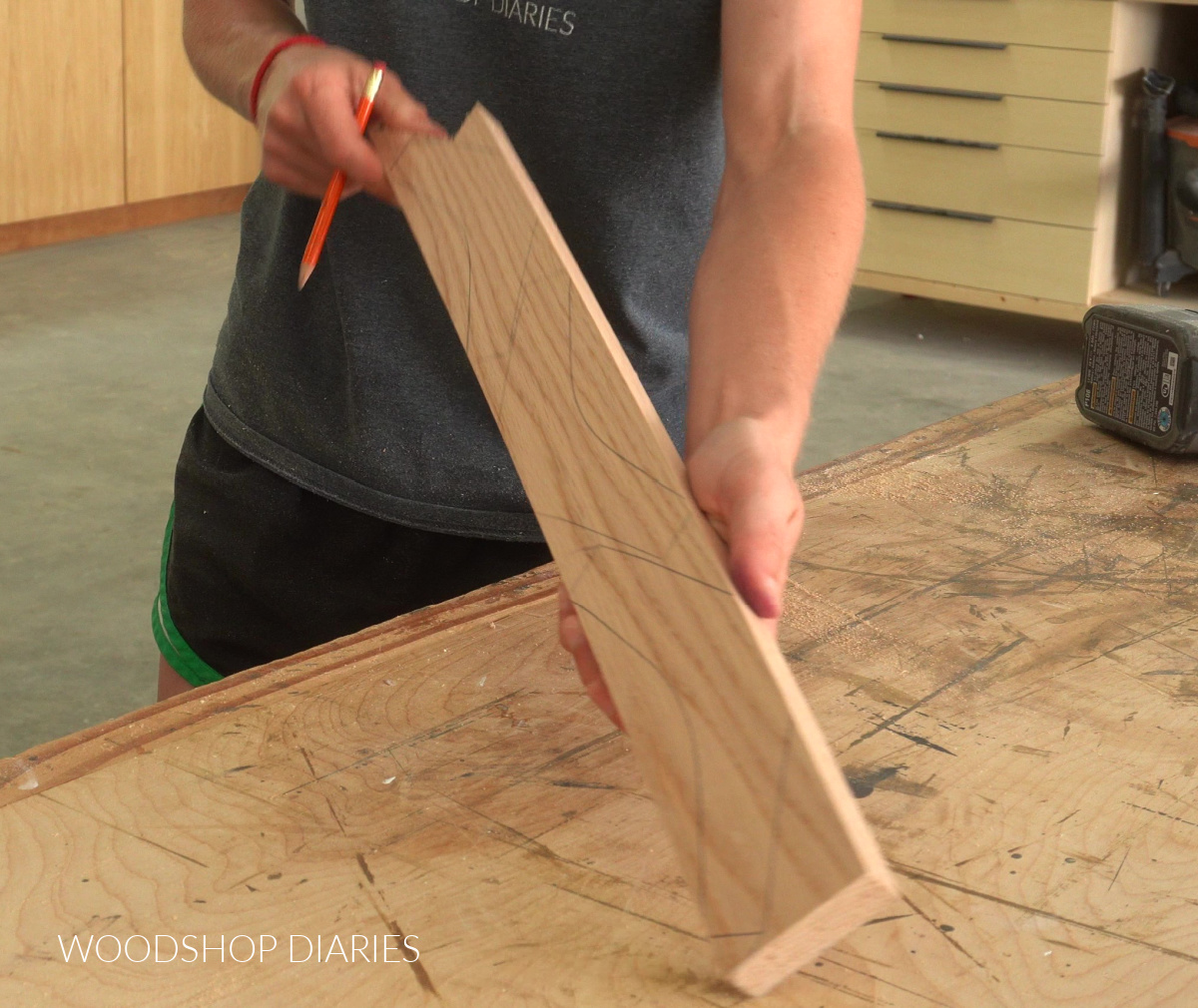 three towel hook pieces traced onto 1x3 board