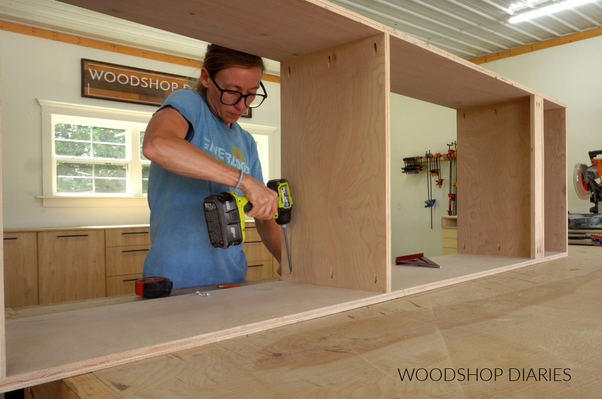 Shara Woodshop Diaries assembling tall closet cabinet with pocket hole screws on workbench
