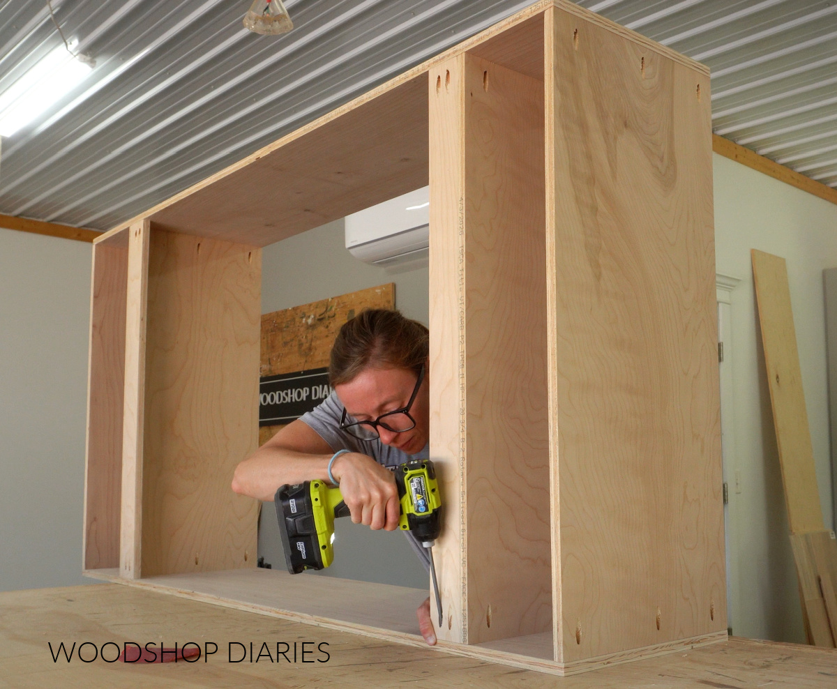 Shara Woodshop Diaries assembling large cabinet box on workbench with pocket hole screws