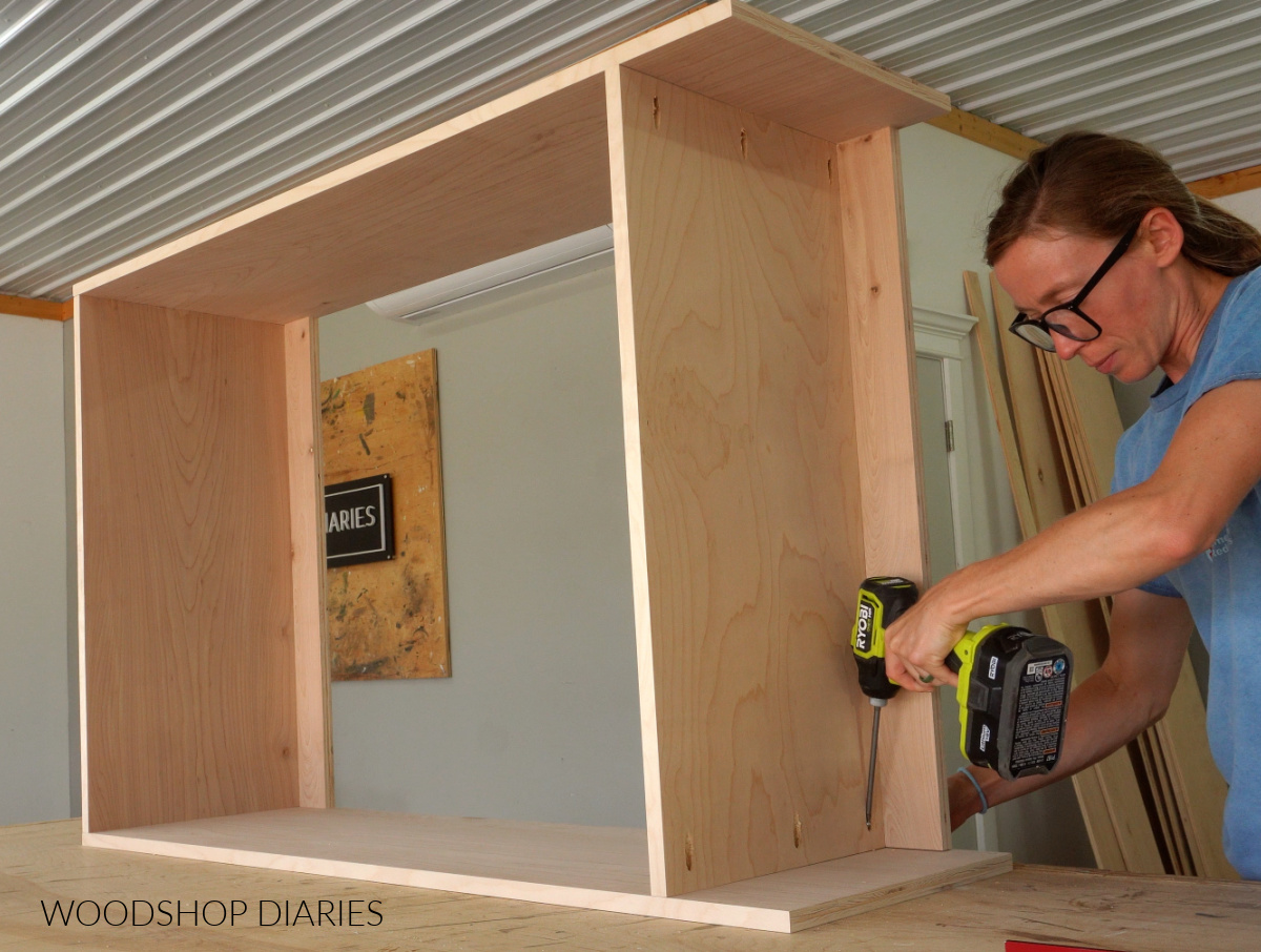 Shara Woodshop Diaries assembling closet cabinet using pocket holes on worktable