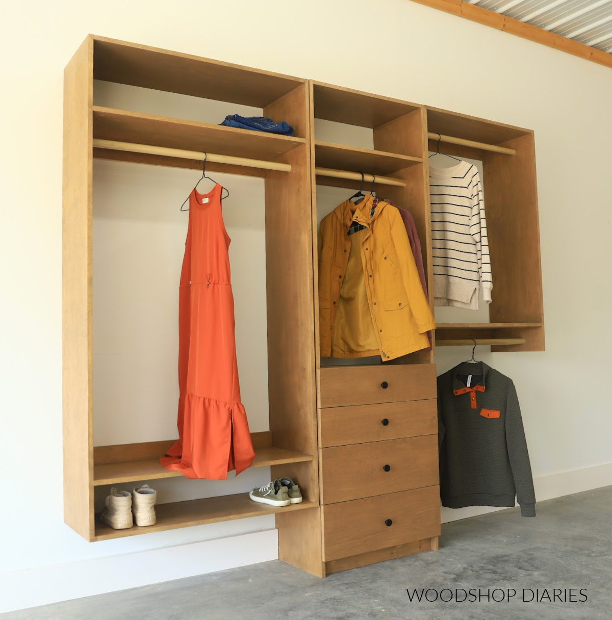 DIY Closet Cabinet System built using plywood with hanging rods, drawers and shelves