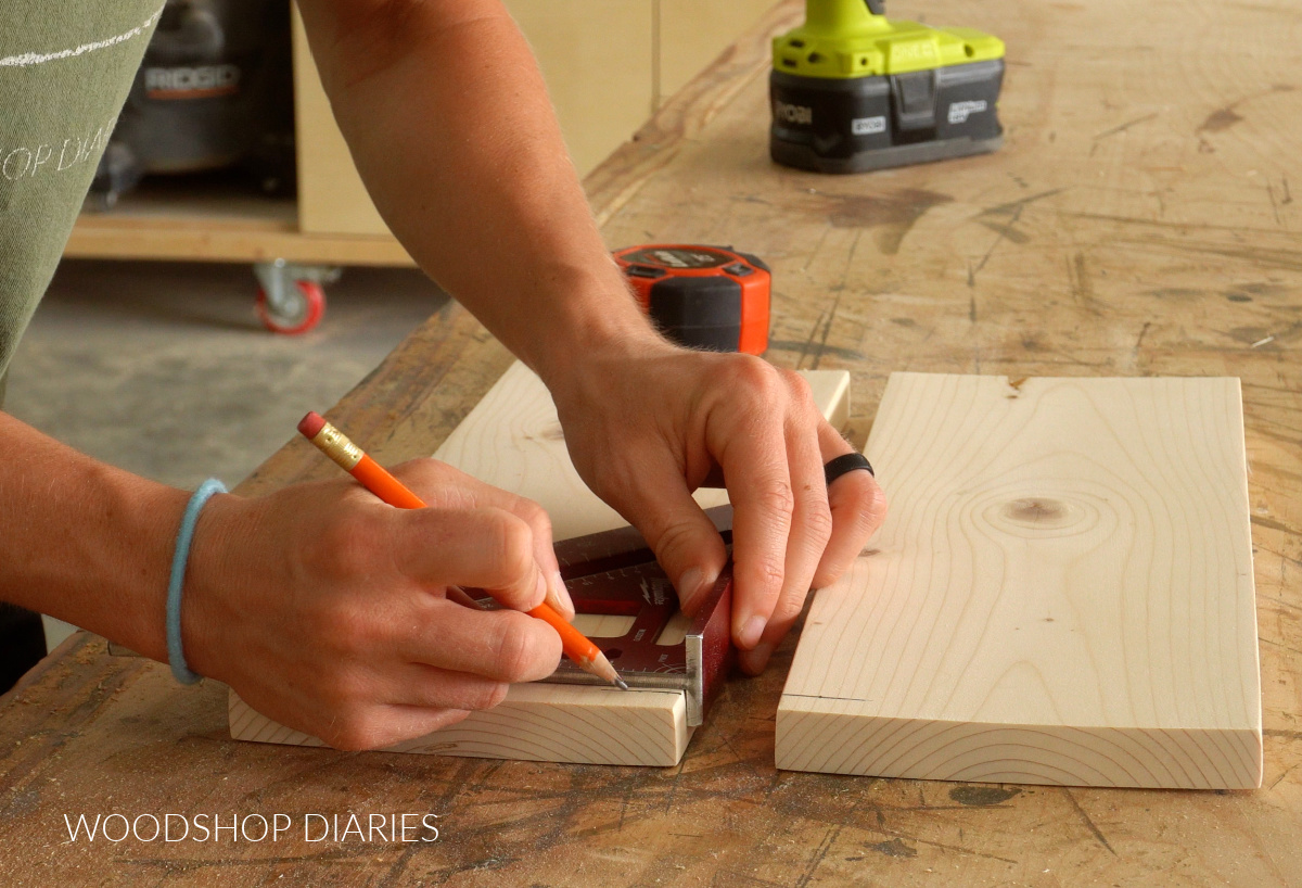 Shara Woodshop Diaries marking hole locations for shelf rail