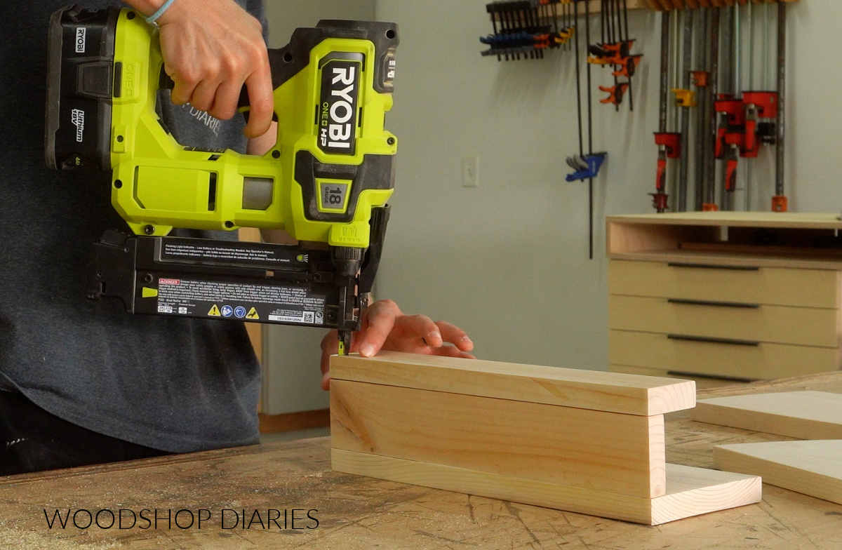Shara Woodshop Diaries brad nailing scrap boards together to make sofa arm tray book rest