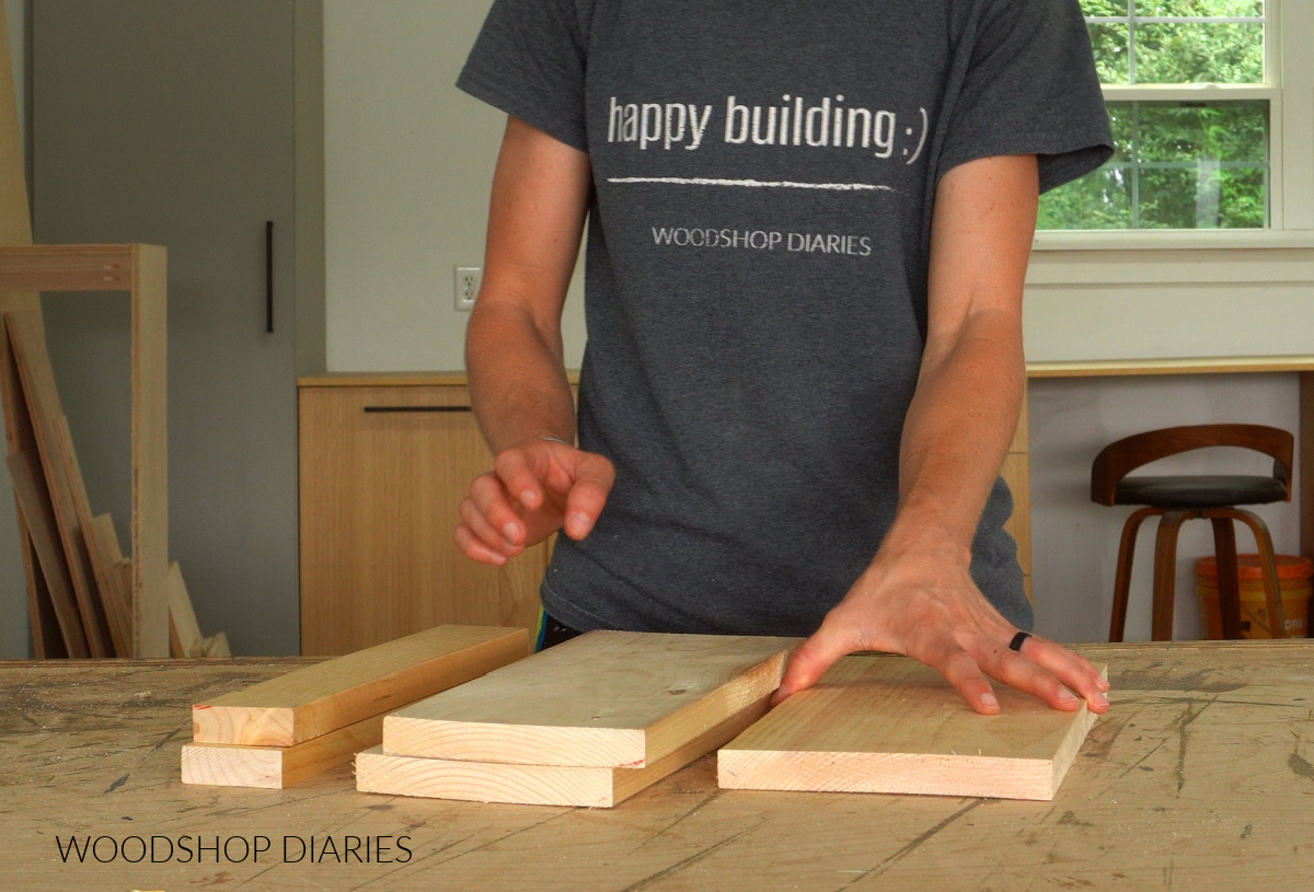 Shara Woodshop Diaries placing boards on workbench to build sofa arm rest with