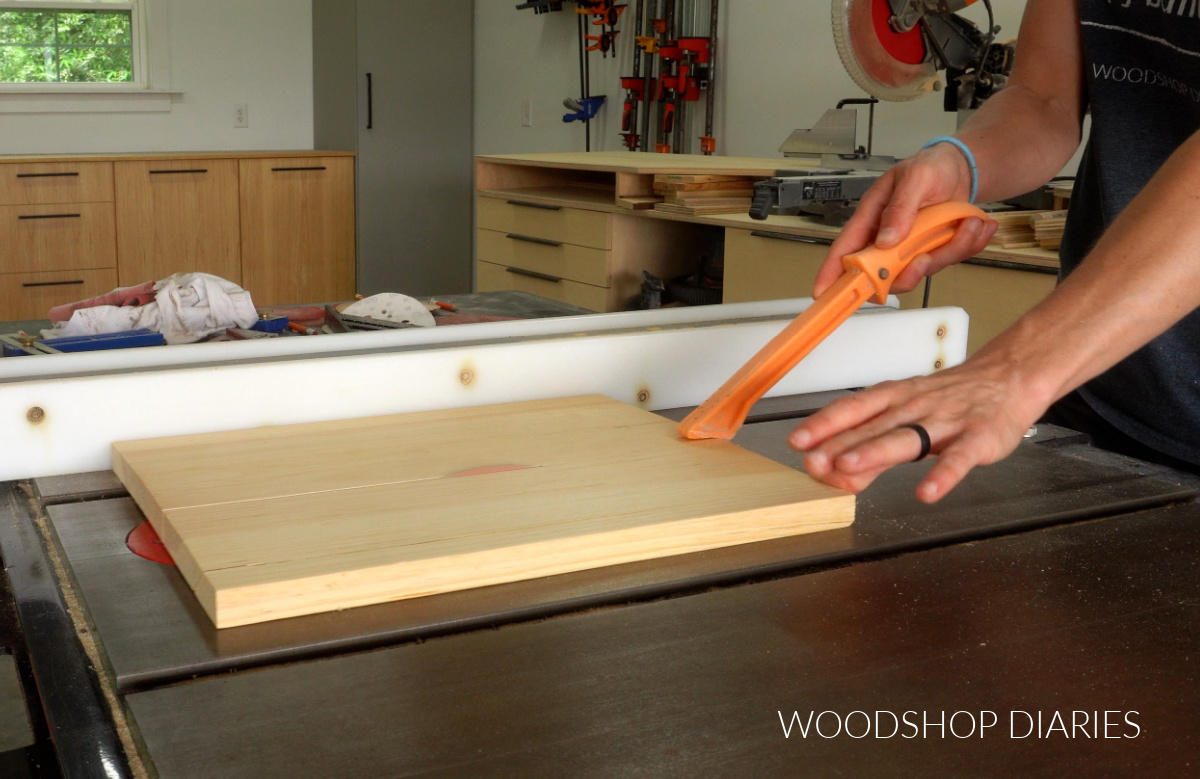 Shara Woodshop Diaries cutting top of sofa arm tray to width on table saw