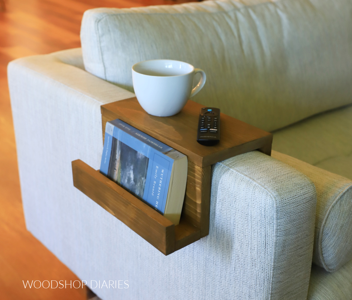 Completed DIY armrest tray on sofa arm