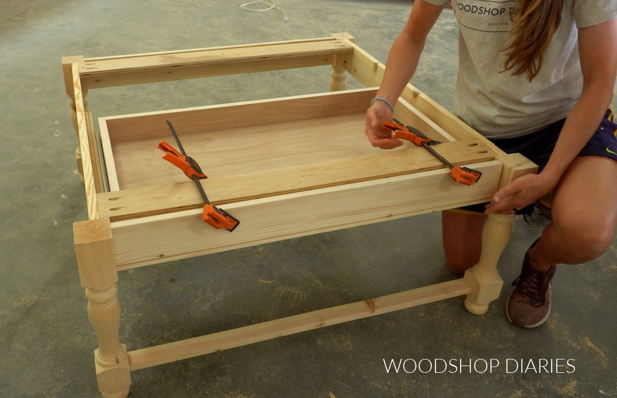 Shara Woodshop Diaries clamping drawer front onto drawer box in DIY Coffee table