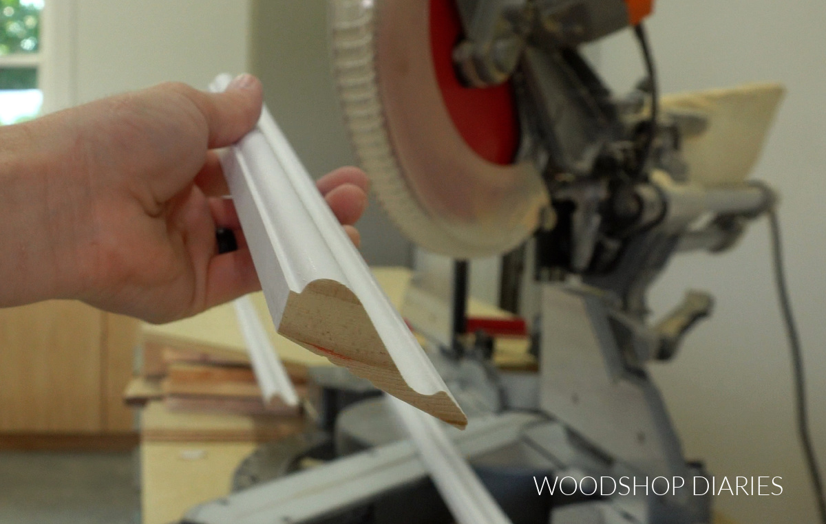 Close up of picture frame base cap molding