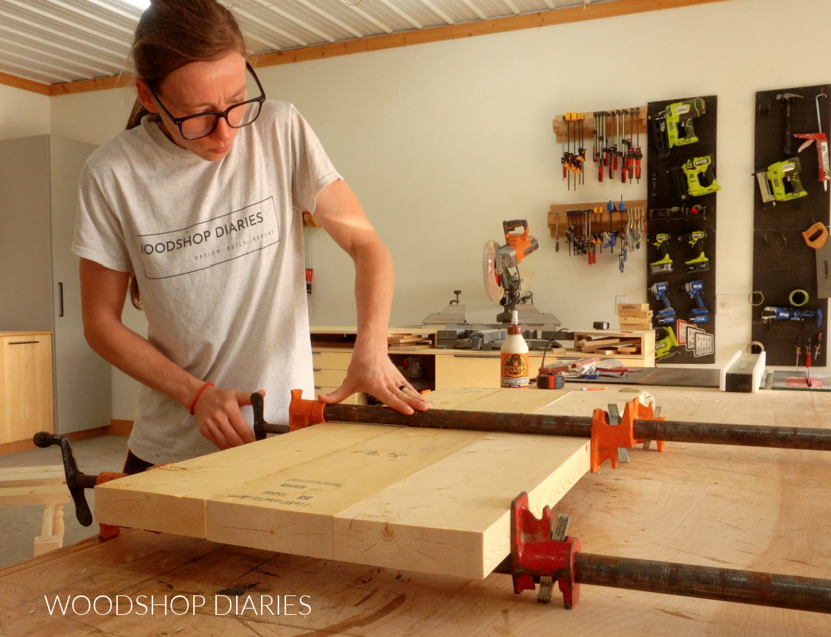 Shara Woodshop Diaries clamping boards on workbench to make coffee table top