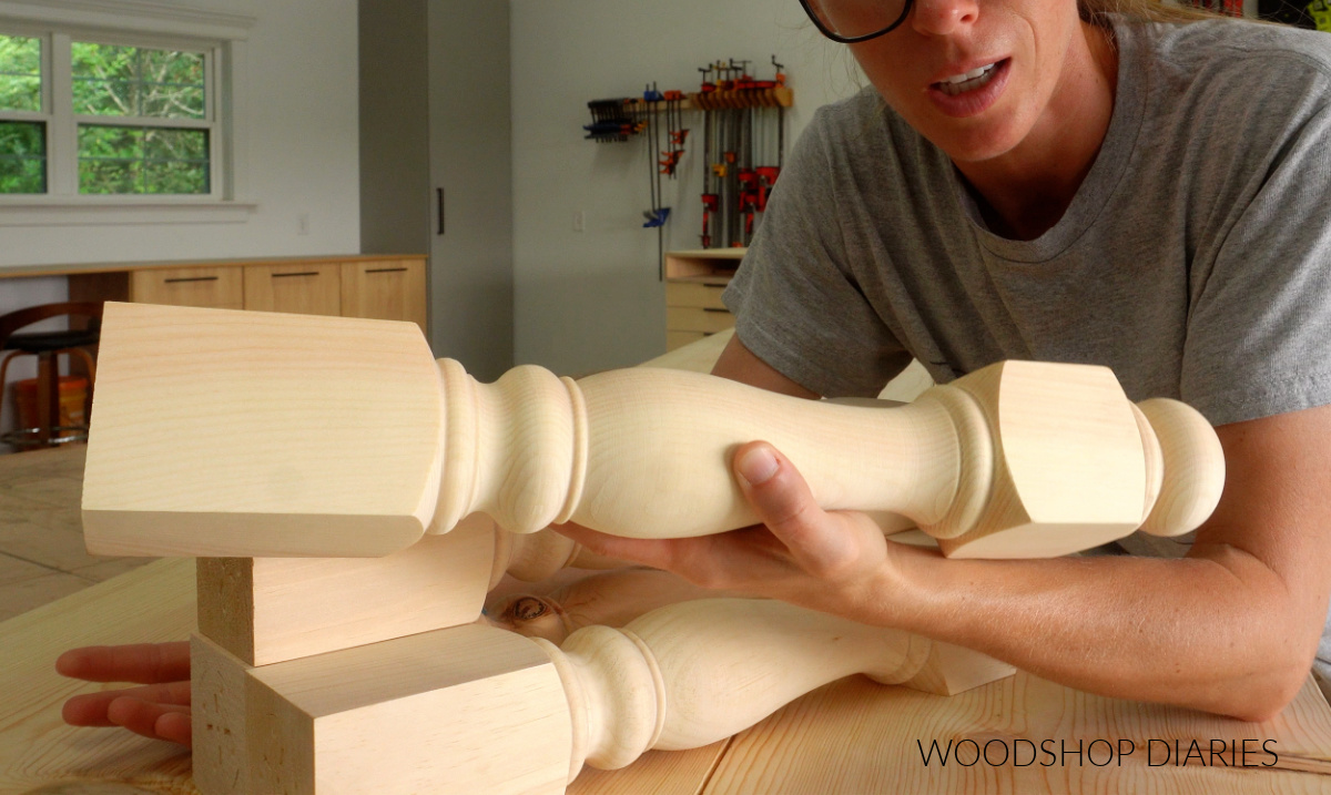 Shara Woodshop Diaries holding turned legs for coffee table