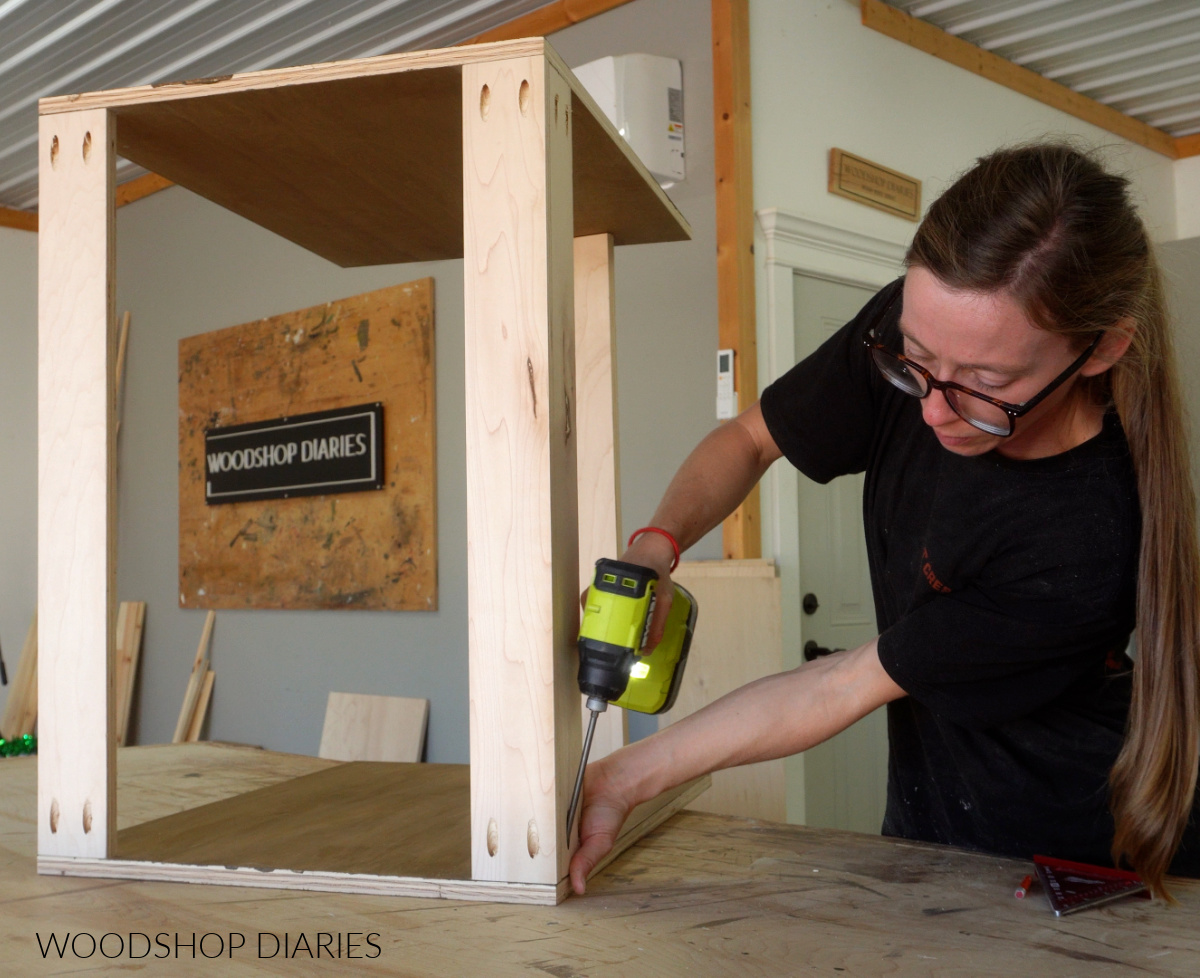 Shara Woodshop Diaries assembling writing desk cabinet on workbench with pocket holes