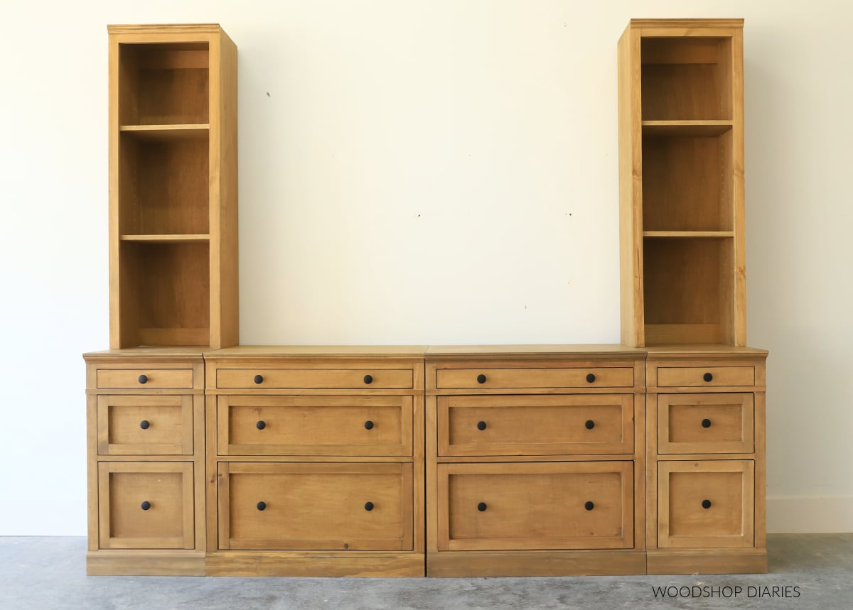 DIY modular furniture system assembled into entertainment center with drawer base cabinets and narrow hutch cabinets on top