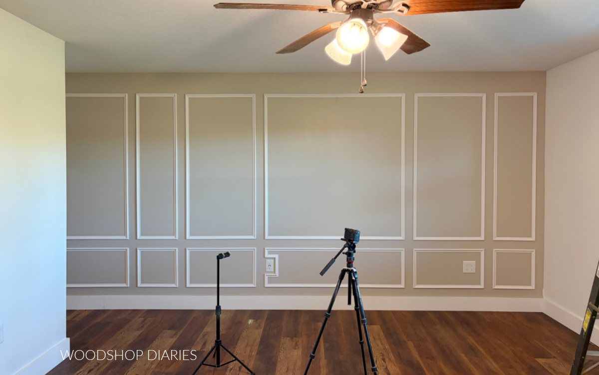 Picture frame molding installed onto bedroom wall before paint